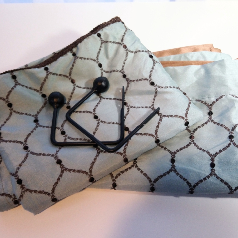 83" curtain panels plus 2 curtain hold backs